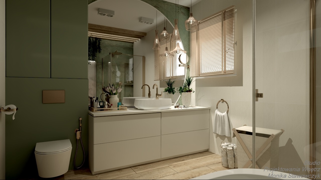Stylowa łazienka z zielonymi akcentami: umywalka nablatowa, drewniane żaluzje, dekoracyjne lampy wiszące i rośliny doniczkowe. Nowoczesny design z dbałością o detale.