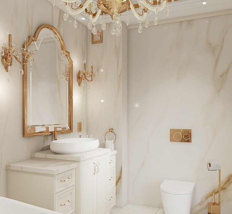 Elegancka łazienka w bieli i złocie: marmurowe ściany, kryształowy żyrandol, owalna umywalka na szafce z frezowanymi frontami, złote akcenty i dekoracyjne kinkiety.