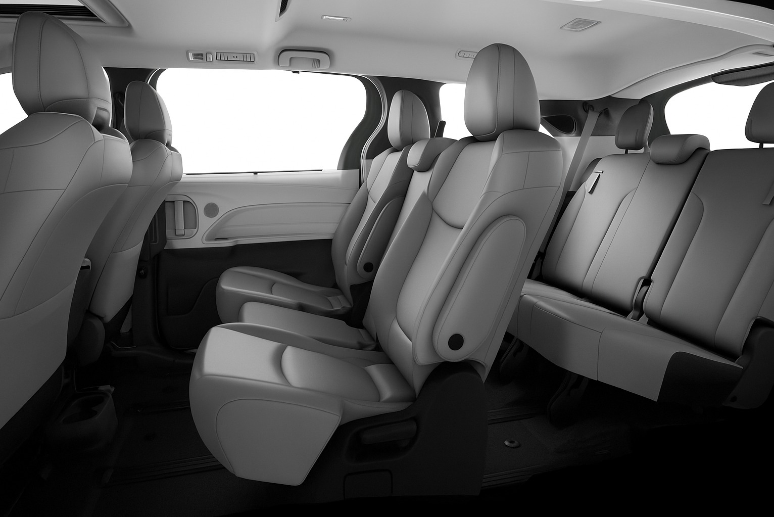 Wnętrze przestronnego busa z jasnymi skórzanymi siedzeniami, idealne do komfortowego przewozu osób w Dzierżoniowie. Widok na fotele pasażerskie.