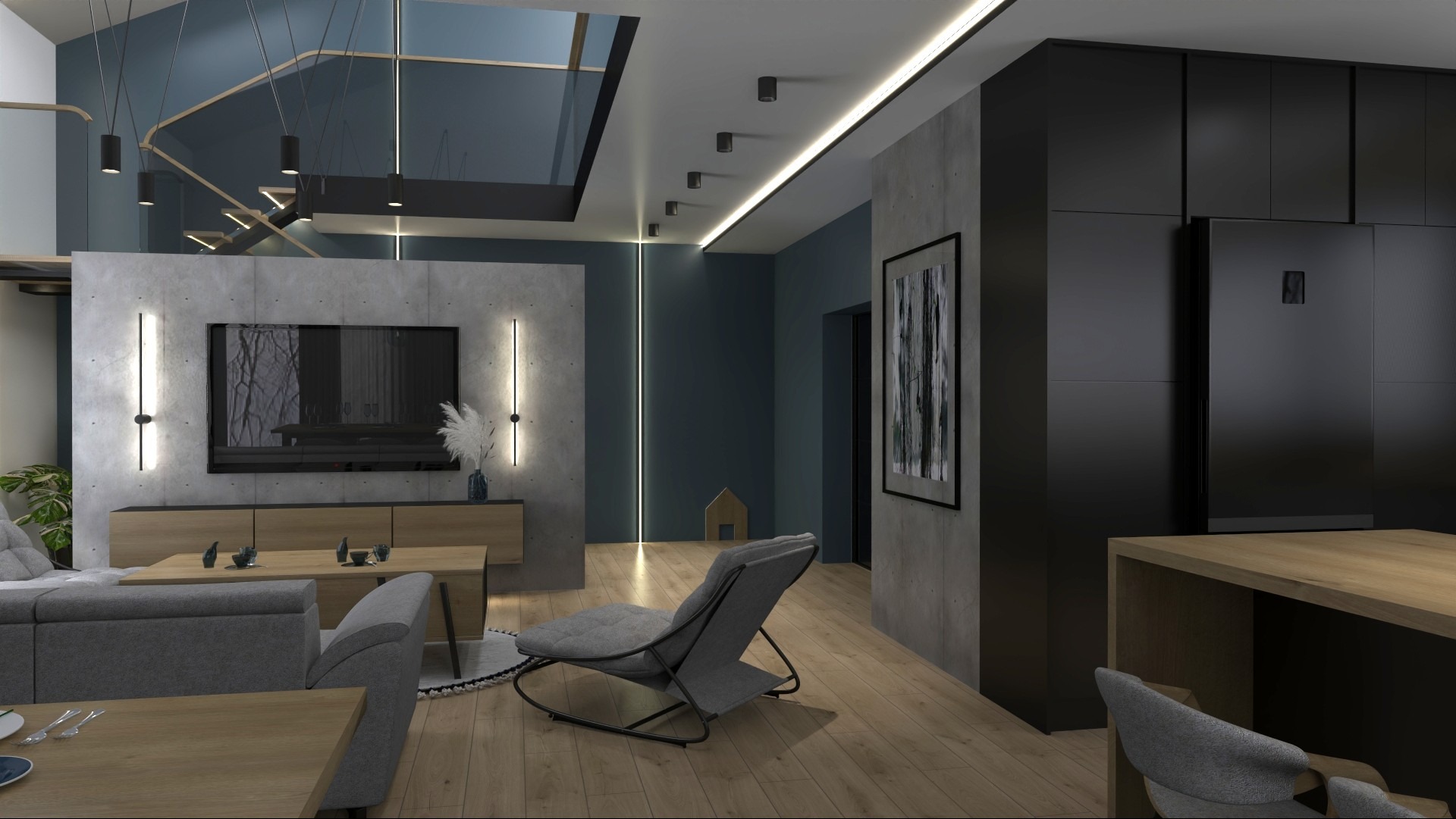 Nowoczesny salon z betonową ścianą, oświetleniem LED, szarą sofą i fotelem. Widoczne schody z przeszkloną balustradą i czarna zabudowa kuchenna.
