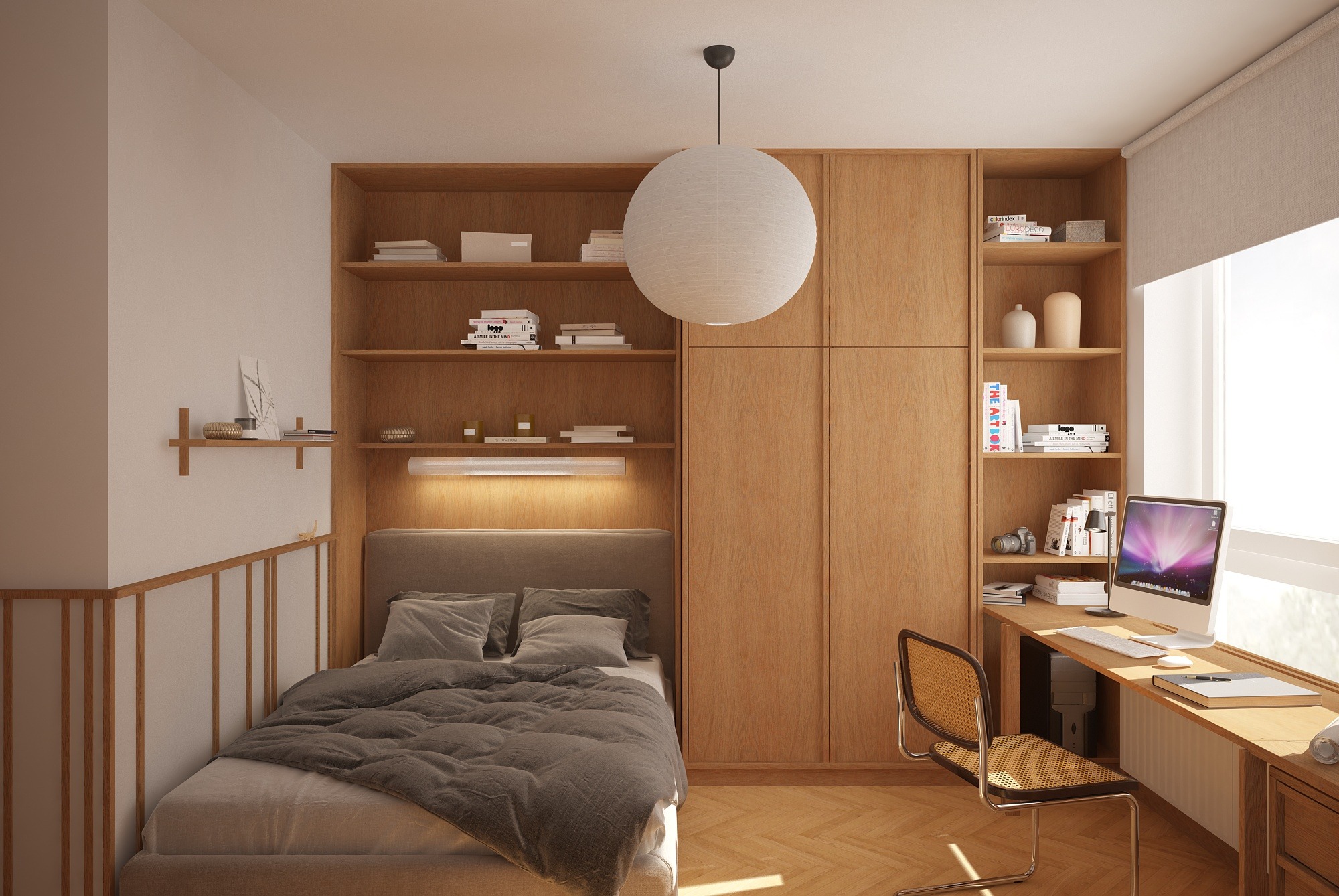 Jasna sypialnia z drewnianą zabudową: szafa, regał i biurko. Minimalistyczny design, okrągła lampa, łóżko z szarą pościelą. Przytulne wnętrze z komputerem przy oknie.