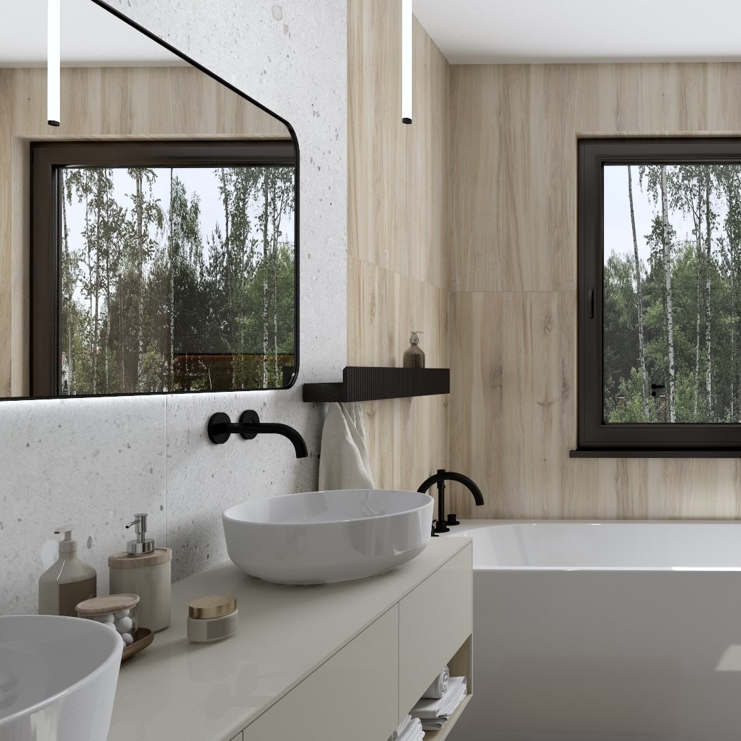 Nowoczesna łazienka z owalną umywalką nablatową, czarną armaturą i dużym lustrem z widokiem na las. Jasne płytki imitujące drewno i kamień tworzą spójną całość.