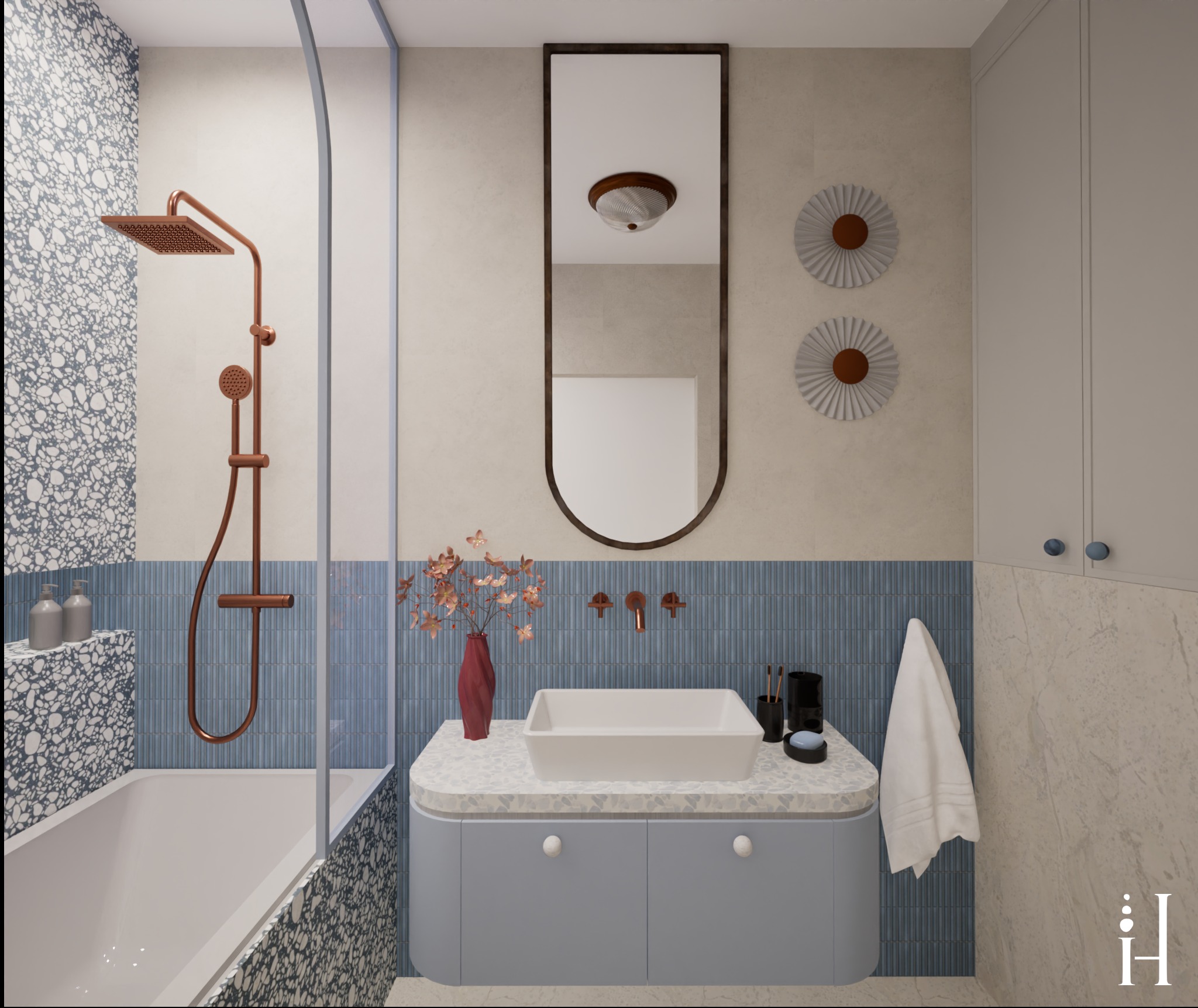 Stylowa łazienka z wanną, prysznicem w kolorze miedzi i umywalką na szafce w odcieniach błękitu. Uwagę przykuwają dekoracyjne detale i lustro w ciemnej ramie.