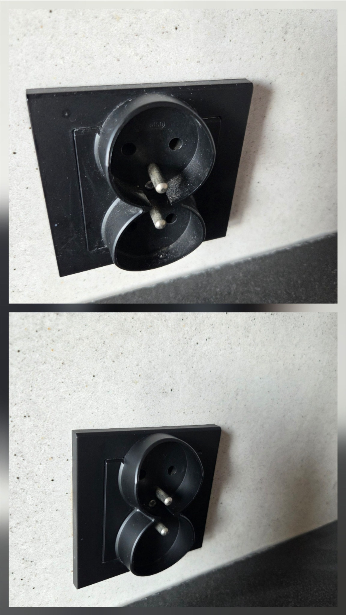 Dwa czarne gniazdka elektryczne Schuko, umieszczone jedno nad drugim, na jasnej, lekko chropowatej ścianie. Widoczne metalowe bolce uziemiające.