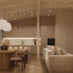 Neuform - Beżowe wnętrze: salon z jadalnią i kuchnią w stylu skandynawskim. Drewniany stół, krzesła, sofa i regał z książkami. Naturalne światło przez okno z żaluzjami.