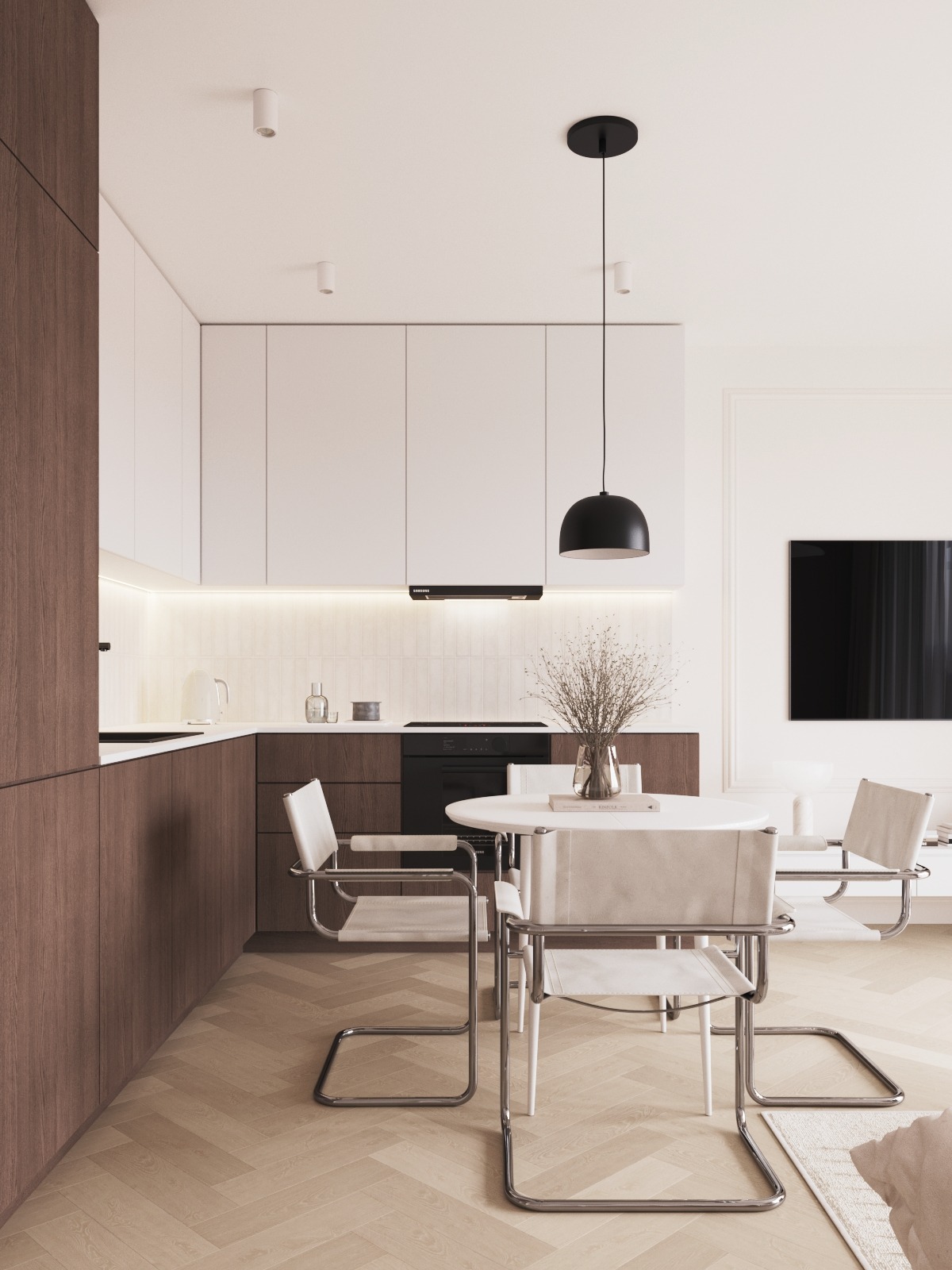 Nowoczesna kuchnia z drewnianymi i białymi szafkami, okrągłym stołem i krzesłami w stylu Bauhaus, oświetlona wiszącą lampą. Parkiet w jodełkę.