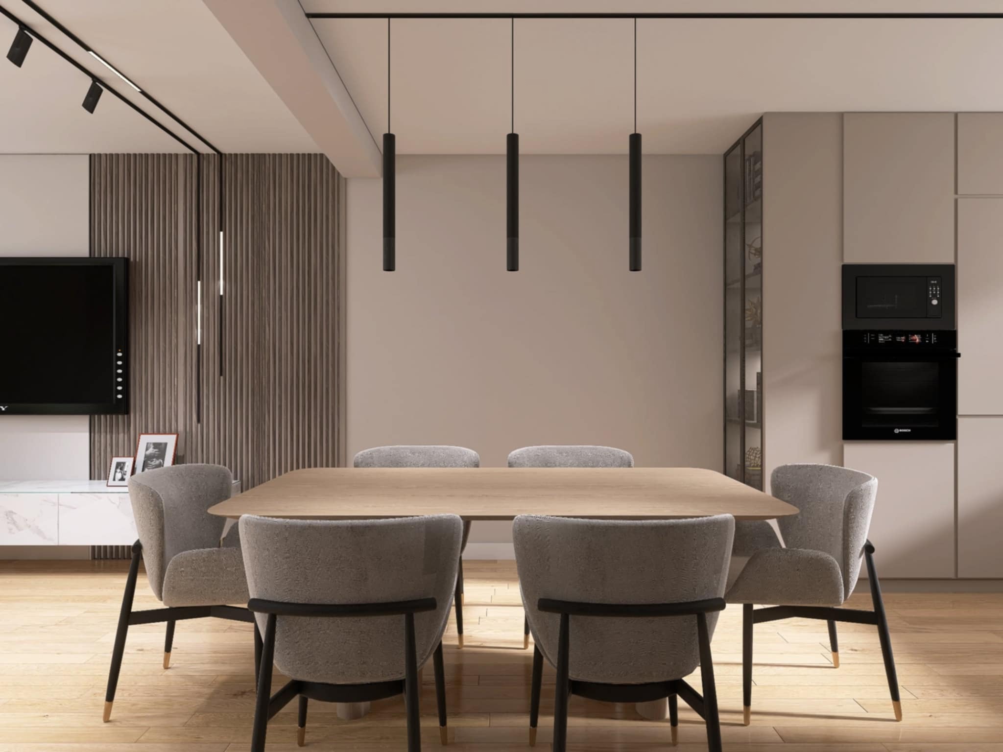 Nowoczesna jadalnia z drewnianym stołem, szarymi krzesłami i minimalistycznym oświetleniem. W tle zabudowa kuchenna i dekoracyjna ściana z lamelami.