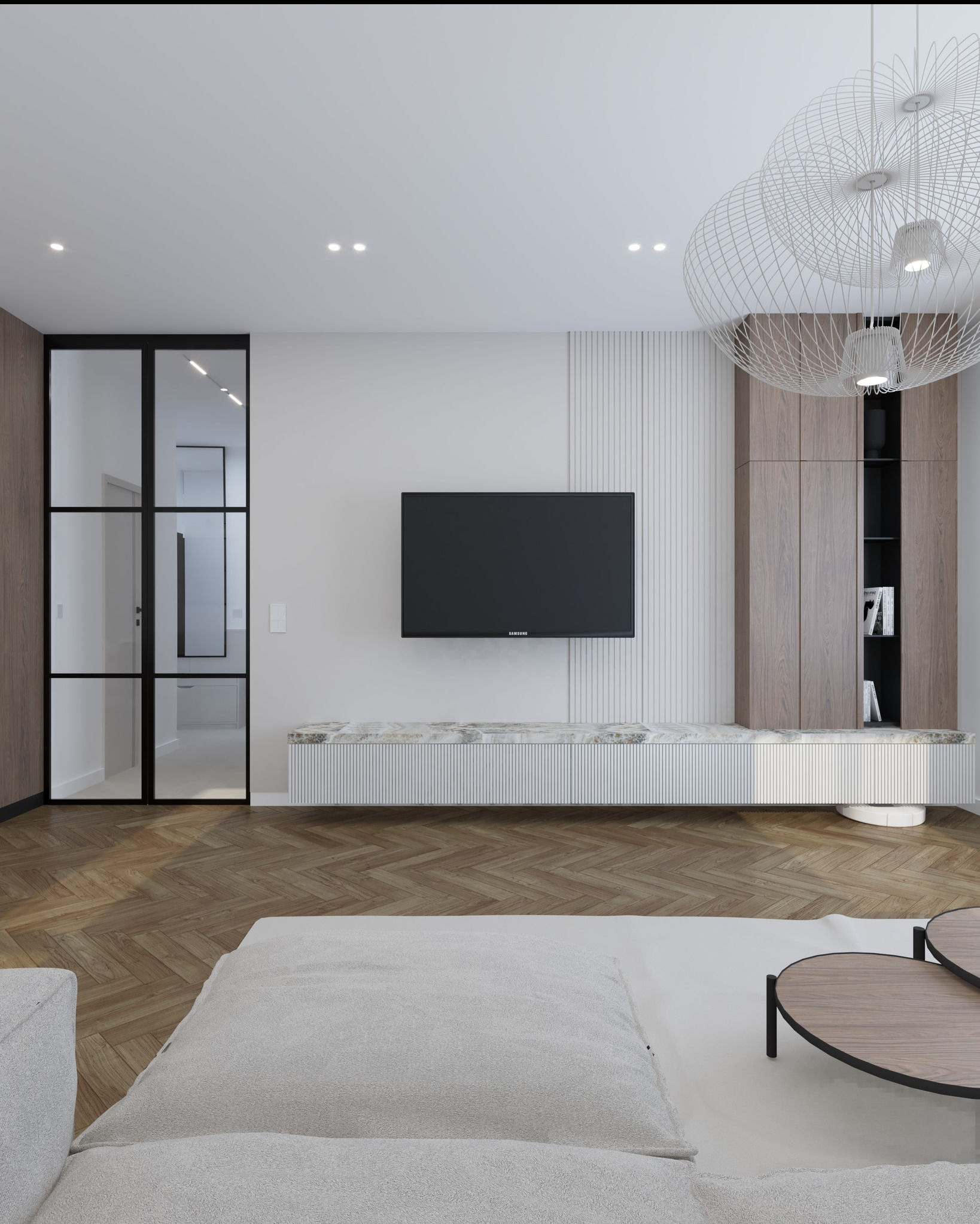 Nowoczesny salon z parkietem w jodełkę, telewizorem na ścianie z lamelami i designerską lampą. Przeszklone drzwi z czarnymi szprosami.