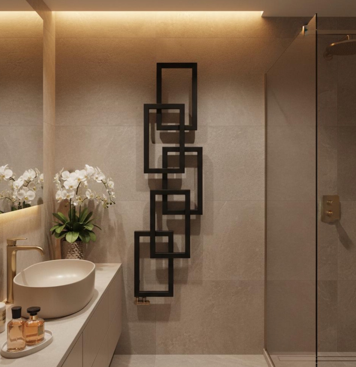 Nowoczesny grzejnik łazienkowy w formie czarnych, geometrycznych ram, zamontowany na szarej ścianie obok kabiny prysznicowej i umywalki z kwiatami.