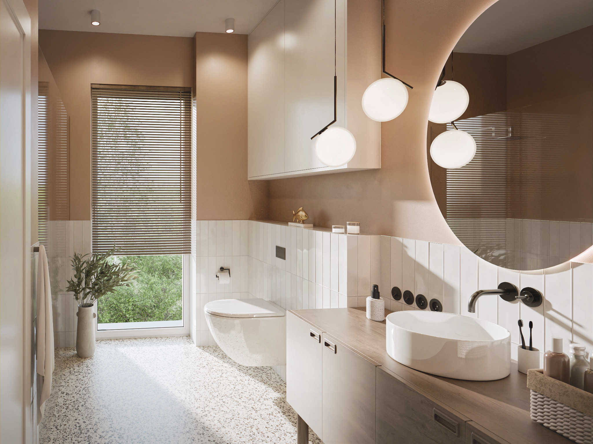 Jasna łazienka z okrągłym lustrem podświetlanym, wiszącą toaletą i umywalką nablatową. Uwagę zwraca podłoga z lastryko i minimalistyczne oświetlenie.