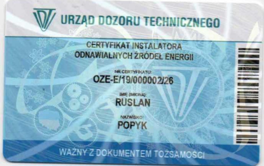 Certyfikat instalatora OZE wydany przez Urząd Dozoru Technicznego na nazwisko Rusłan Popyk, z numerem OZE-E/19/000002/26. Ważny z dokumentem tożsamości.