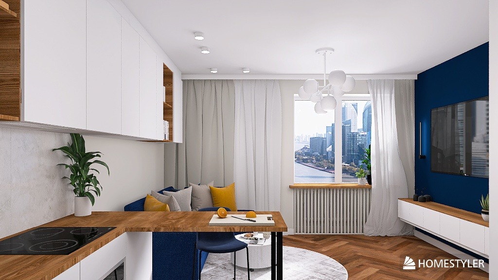 Nowoczesne wnętrze mieszkania z aneksem kuchennym, drewnianym blatem i niebieską ścianą. Widok na miasto przez okno. Parkiet w jodełkę i designerska lampa.