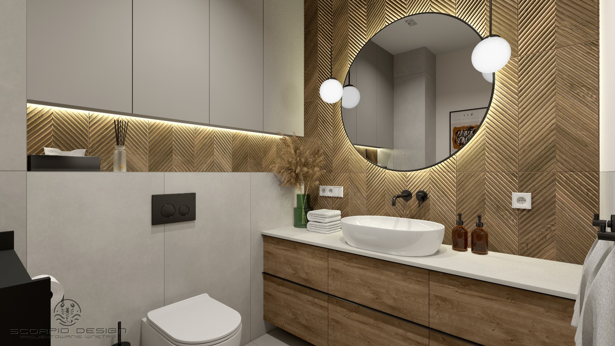 Nowoczesna łazienka z drewnianą mozaiką w jodełkę, okrągłym lustrem z podświetleniem i minimalistyczną armaturą. Umywalka nablatowa, drewniana szafka i szara zabudowa.