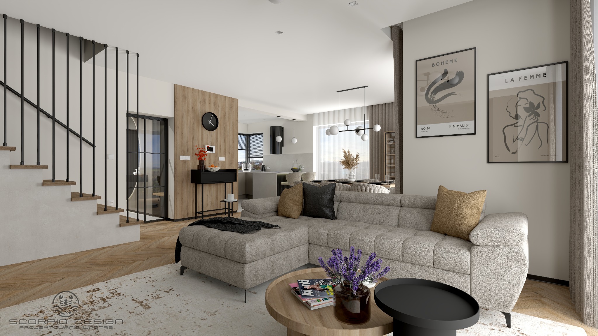 Jasne wnętrze z narożną sofą, stolikami kawowymi i schodami z czarnymi balustradami. W tle widoczna kuchnia i jadalnia. Na ścianie grafiki w czarnych ramach.