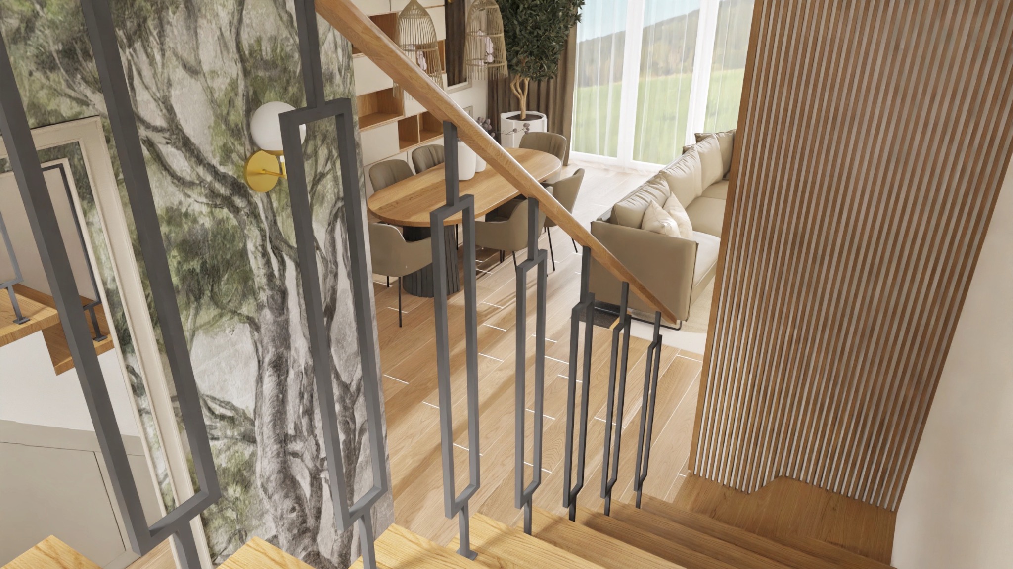 Nowoczesne wnętrze domu z drewnianymi schodami, szarą balustradą i fototapetą z motywem drzewa. Widok z góry na salon z jadalnią i sofą.