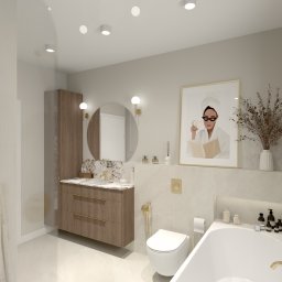 PiK25 Interiors by Klaudia Piasna - Elegancka łazienka w stylu modern classic z drewnianą szafką pod umywalką, okrągłym lustrem i subtelnymi złotymi akcentami. Uwagę przykuwa grafika w złotej ramie.