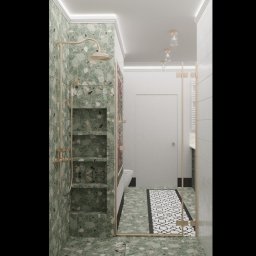 Chaberek Paweł Business Consulting - Nowoczesna łazienka z zielonymi płytkami lastryko, złotą armaturą i kabiną prysznicową ze złotymi profilami. W tle białe drzwi i wzorzysty dywanik.