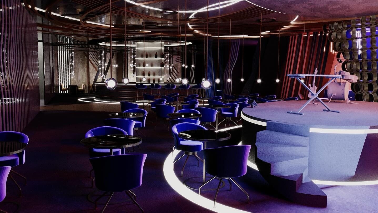 Wnętrze baru muzycznego z podwyższoną sceną, okrągłymi stolikami i krzesłami w odcieniach fioletu. Oświetlenie punktowe i dekoracyjne elementy architektoniczne.