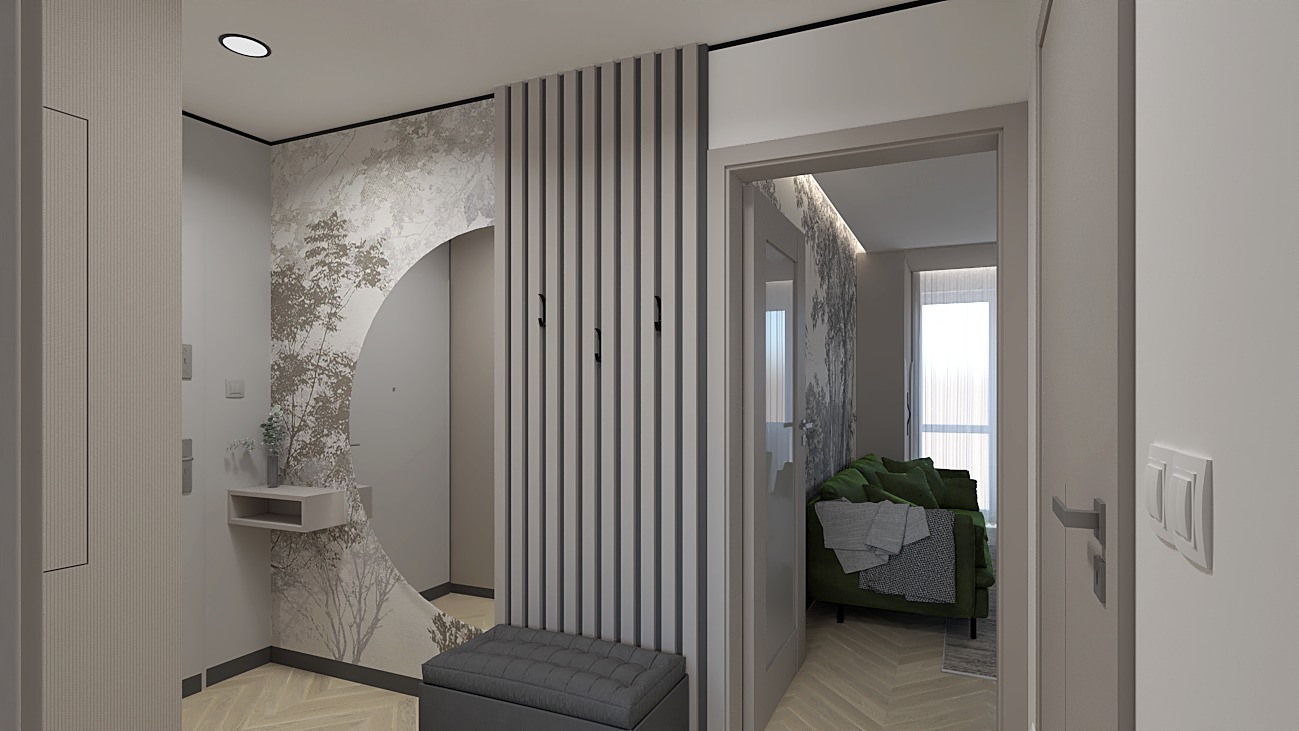 Nowoczesny przedpokój z tapetą w motywy leśne, szarą ścianką z wieszakami i siedziskiem. Widok na salon z zieloną sofą. Parkiet w jodełkę.