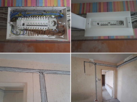 Rozdzielnice elektryczne w obudowach i kable prowadzone po ścianach w nowym budynku. Widoczne zabezpieczenia i przewody w różnych kolorach.