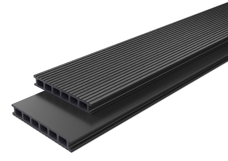 Przekrój dwóch desek kompozytowych w odcieniach szarości. Górna deska ryflowana, dolna gładka, obie z widocznymi komorami wewnętrznymi. Precyzyjne wykonanie.