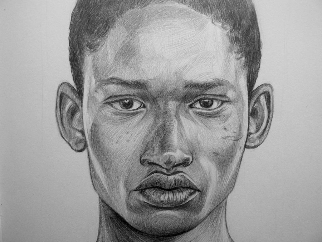 Realistyczny, czarno-biały portret mężczyzny, wykonany ołówkiem. Widoczne detale twarzy, subtelne cieniowanie i faktura papieru. Ujęcie frontalne, skupione na wyrazie.