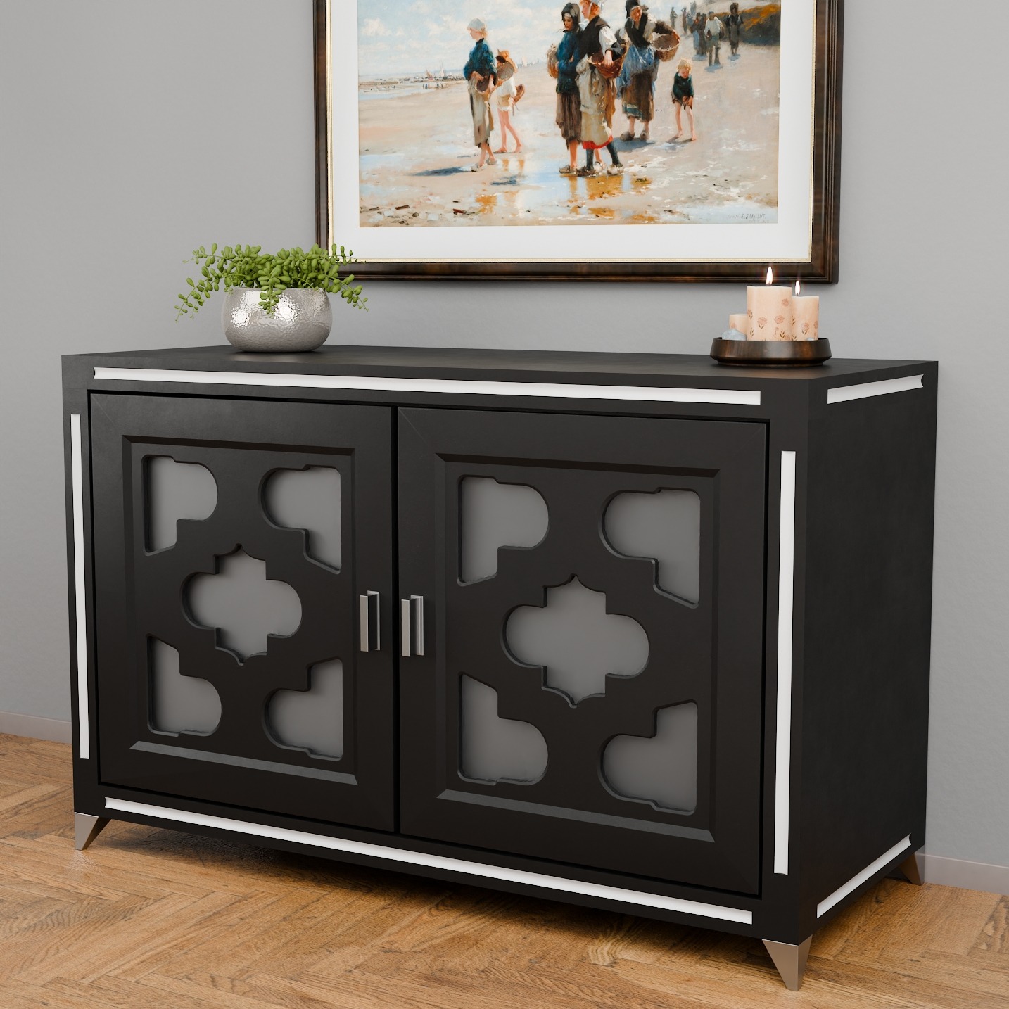 Czarna komoda z dekoracyjnymi drzwiczkami i srebrnymi akcentami, stojąca na drewnianej podłodze, z obrazem i rośliną na górze. Nowoczesny design.