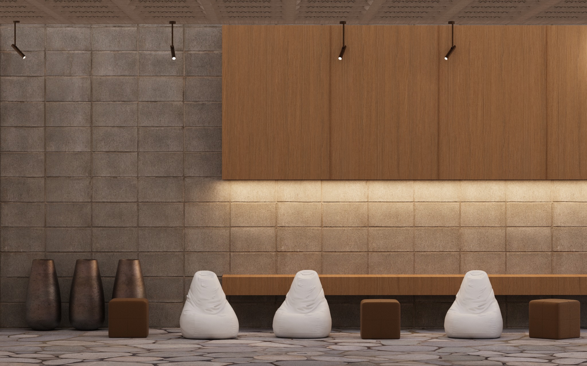 Minimalistyczna aranżacja wnętrza z szarą ścianą z bloków, drewnianą zabudową, trzema białymi pufami i metalowymi wazonami. Oświetlenie punktowe podkreśla teksturę.