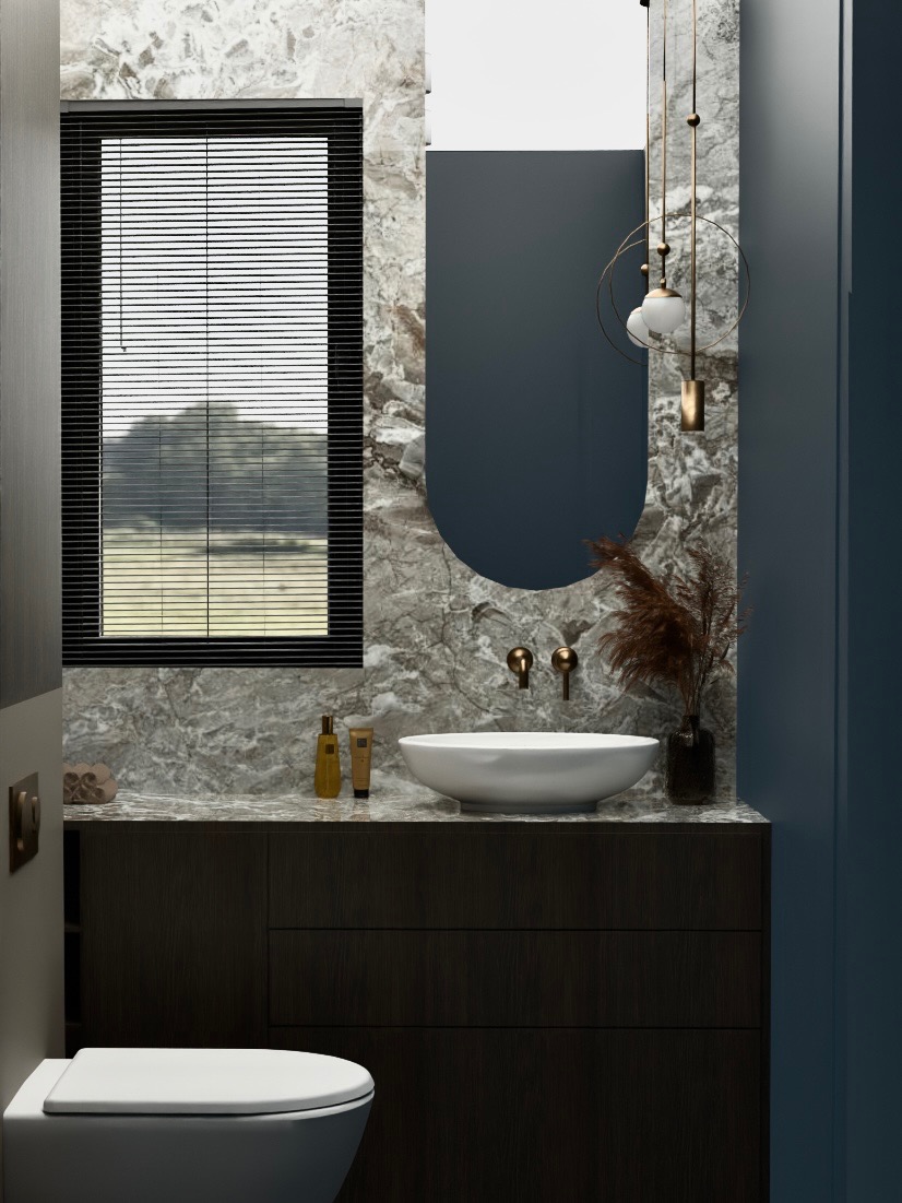 Nowoczesna łazienka z marmurową ścianą, owalnym lustrem i wiszącą lampą. Umywalka nablatowa, ciemne szafki i okno z żaluzjami tworzą elegancki wystrój.