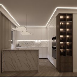 DNP Trading&Development Sp. z o.o. - Nowoczesna kuchnia z wyspą o marmurowym wzorze, białymi szafkami i oświetleniem LED. Uwagę przyciąga przeszklona witryna z podświetleniem i designerska lampa.