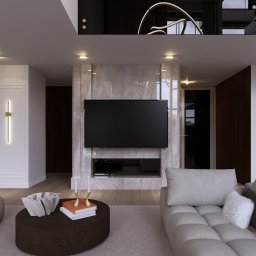DNP Trading&Development Sp. z o.o. - Elegancki salon z marmurową ścianą TV, nowoczesnym oświetleniem i sofą w odcieniach szarości. Na stoliku dekoracje i książki. Minimalistyczny design wnętrza.
