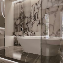 DNP Trading&Development Sp. z o.o. - Elegancka łazienka z wanną wolnostojącą, marmurowymi ścianami i podświetlaną podłogą. Nowoczesny design z akcentami luksusu i minimalistycznym wyposażeniem.