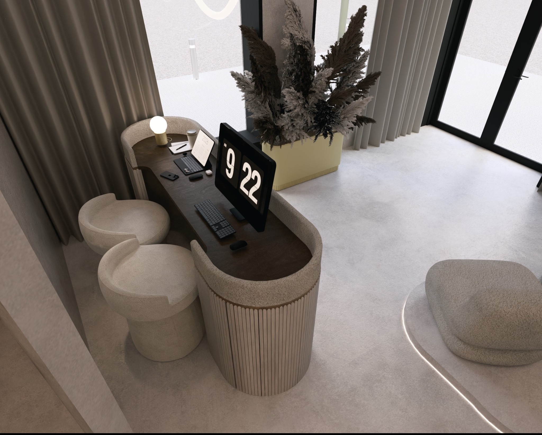 Nowoczesne biuro domowe z biurkiem o zaokrąglonym kształcie, dwoma pufami i fotelem. Na biurku laptop, monitor z godziną 9:22 i dekoracyjna roślina w doniczce.