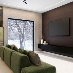 Maciej Dorlet - Nowoczesny salon z zieloną sofą modułową i widokiem na zimowy krajobraz za oknem. Minimalistyczna szafka RTV i oświetlenie szynowe.