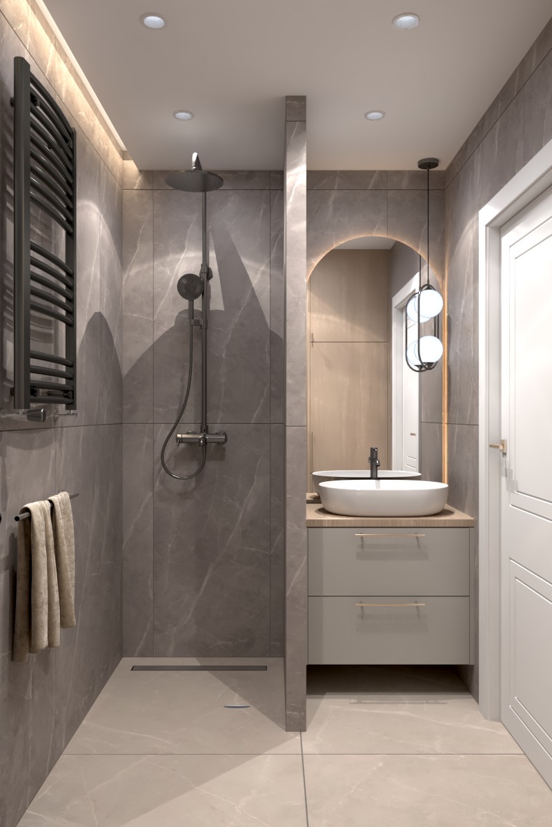 Nowoczesna łazienka z kabiną prysznicową typu walk-in, umywalką nablatową i podświetlanym lustrem w kształcie łuku. Szare płytki imitujące marmur.