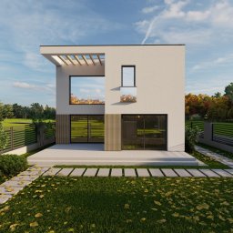 Dwukondygnacyjny dom z płaskim dachem i dużymi oknami, otoczony zielenią i nowoczesnym ogrodzeniem. Widoczne płyty chodnikowe prowadzące do wejścia.