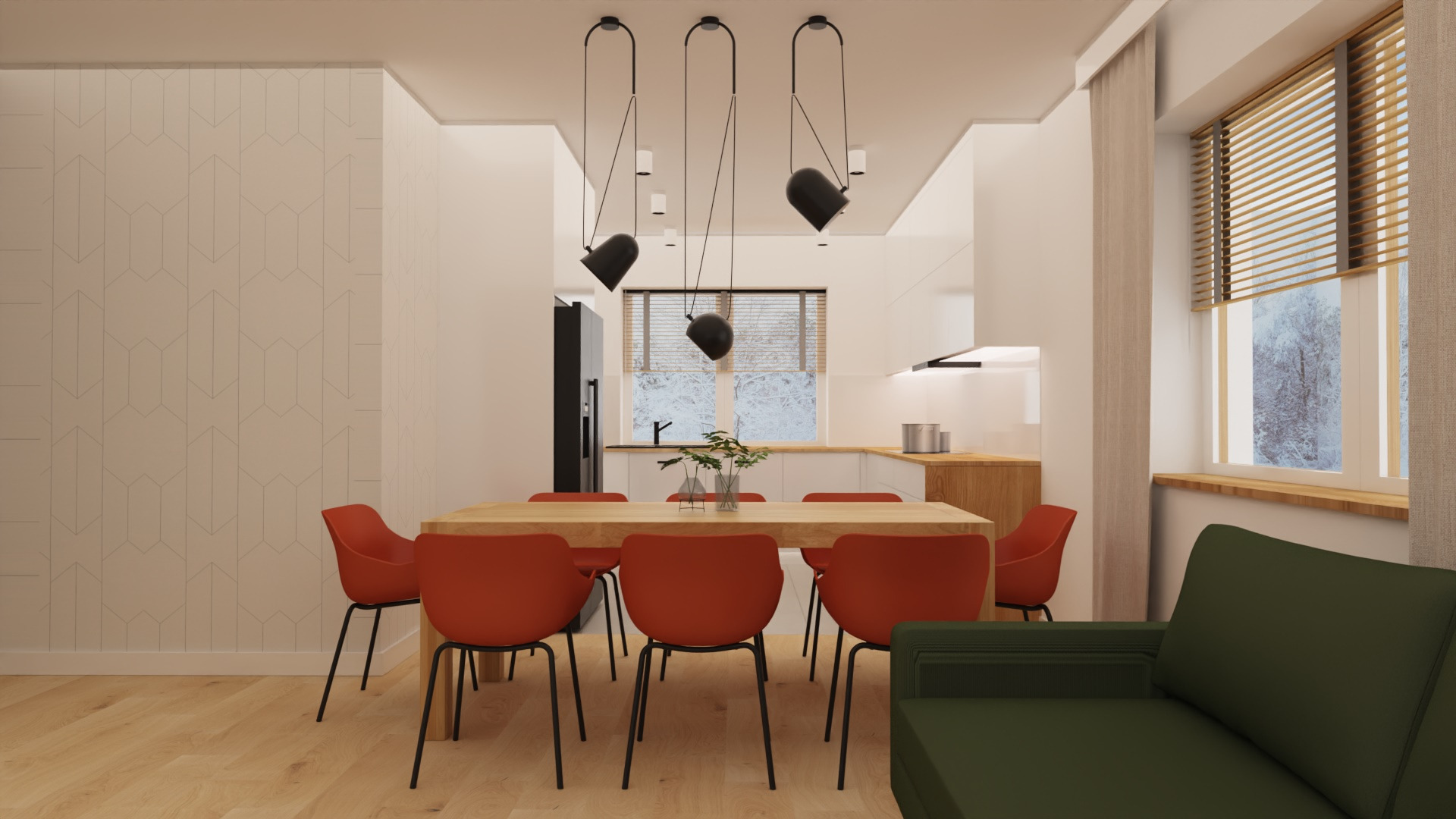 Jasne wnętrze z drewnianym stołem i czerwonymi krzesłami. W tle widoczna kuchnia z oknem na zimowy krajobraz. Minimalistyczne lampy wiszące nad stołem.