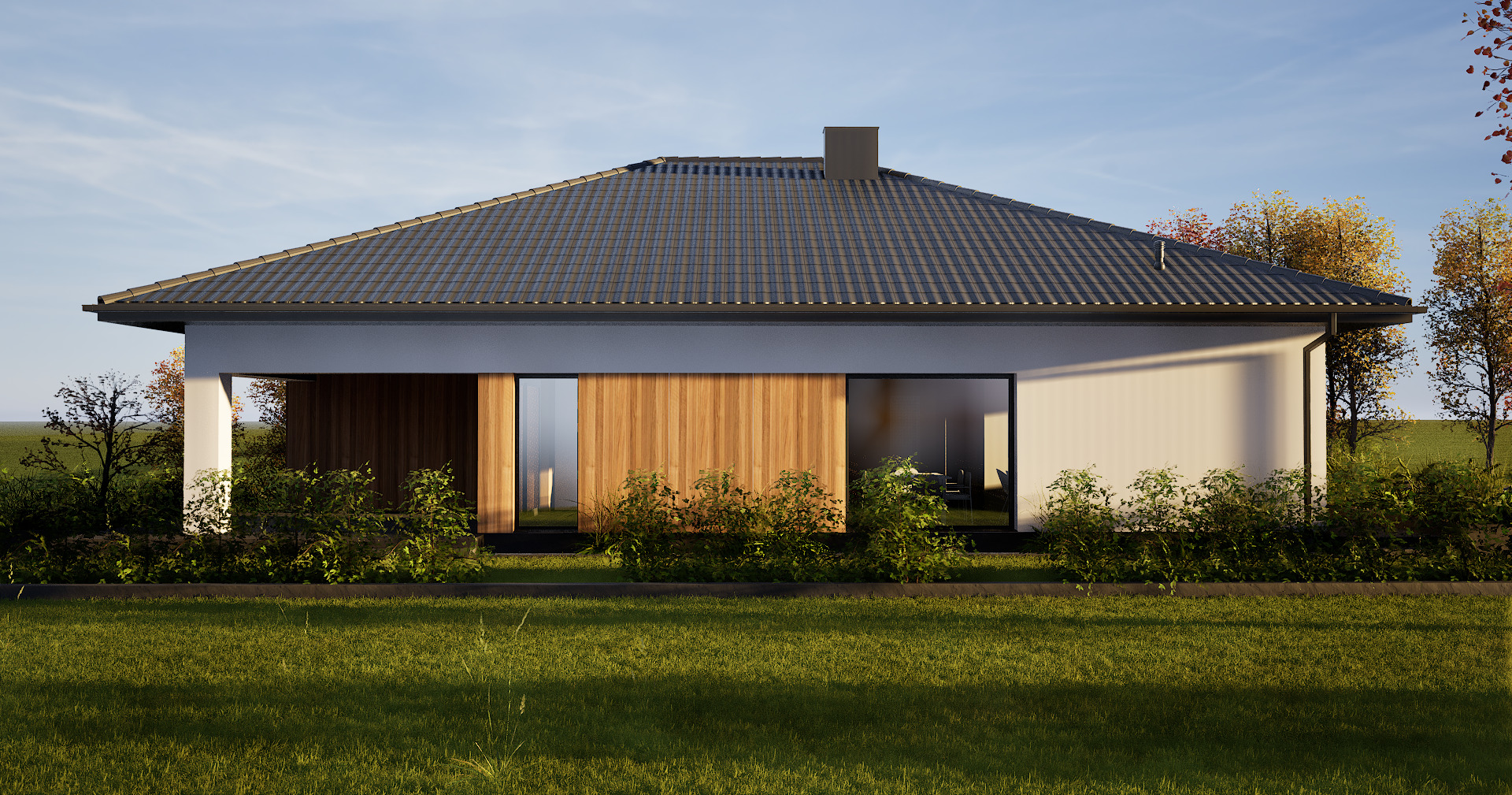 Elewacja nowoczesnego domu jednorodzinnego z drewnianymi akcentami i dużymi oknami, otoczona zielenią w Dębicy. Minimalistyczny styl, dachówka w kolorze grafitowym.