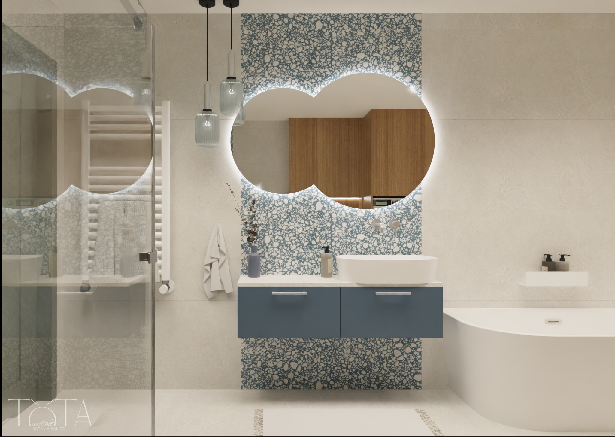 Nowoczesna łazienka z umywalką nablatową na szafce w kolorze granatowym, podświetlanym lustrem o nieregularnym kształcie i kabiną prysznicową ze szklanymi drzwiami.