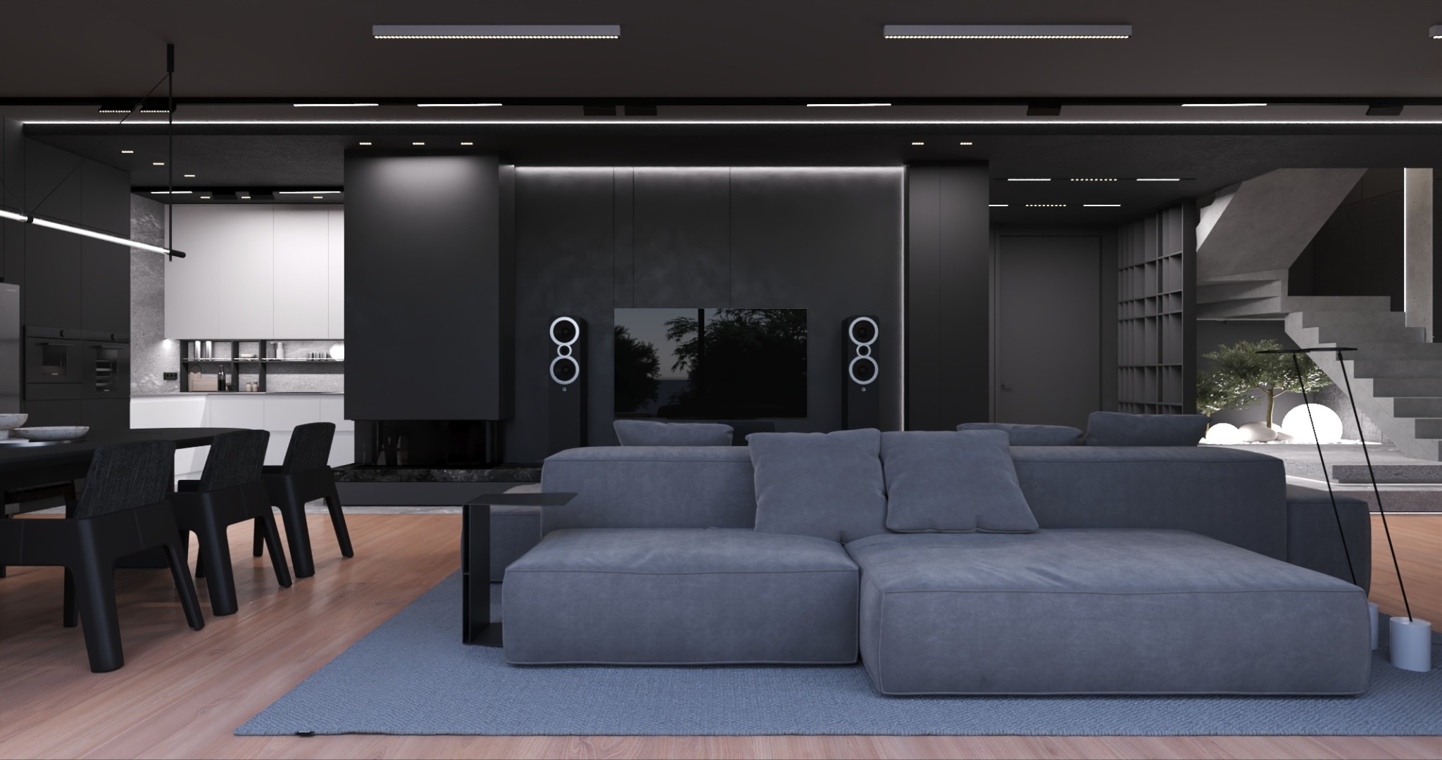 Nowoczesny salon z szarą sofą modułową na tle czarnej ściany z kominkiem i telewizorem. Widoczna jadalnia i schody. Minimalistyczny design z oświetleniem LED.