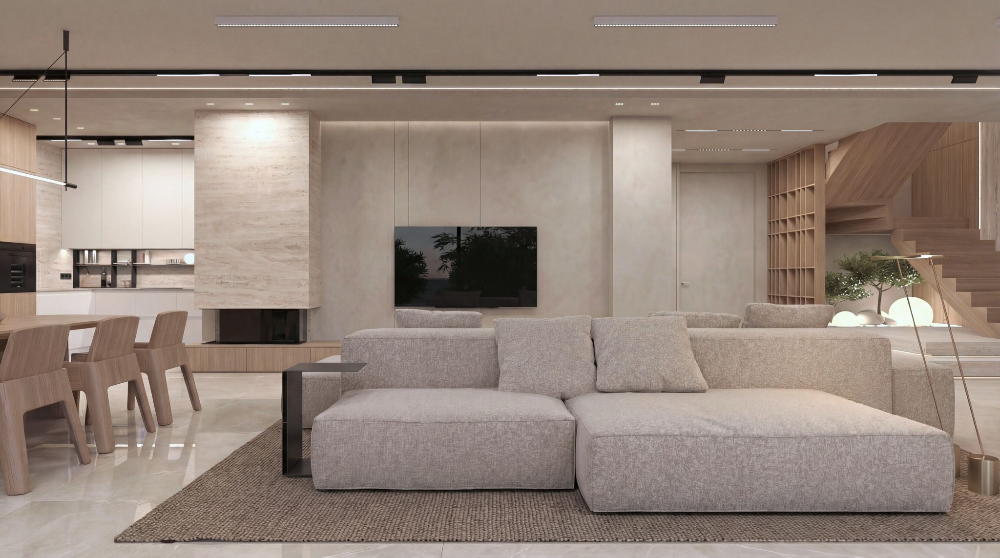 Jasne, przestronne wnętrze domu z beżową sofą modułową, kominkiem z kamienia i drewnianymi schodami. Minimalistyczny design z akcentami roślinnymi i nowoczesnym oświetleniem.