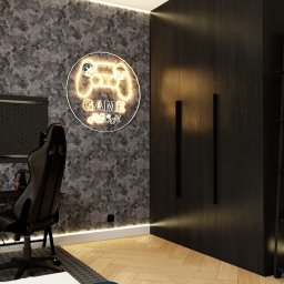 Chicc Interiors - Nowoczesny pokój gracza w Szczecinie: heksagonalna ściana, neonowy kontroler, czarne meble i drewniana podłoga. Stylowa aranżacja wnętrza.