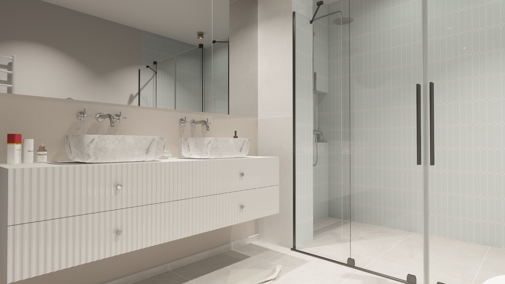 Nowoczesna łazienka z marmurowymi umywalkami nablatowymi, białą szafką z frezowanymi frontami i kabiną prysznicową z grafitowymi profilami. Pastelowe płytki na ścianie.