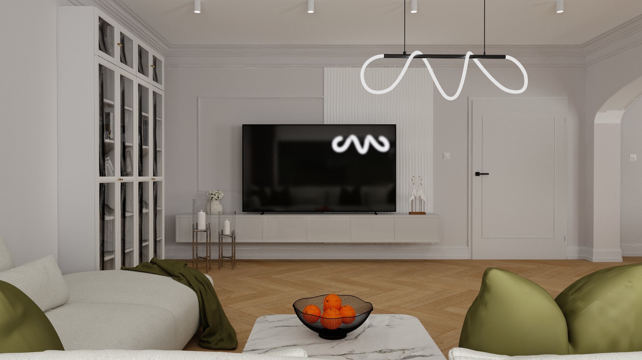 Elegancki salon z telewizorem, białą szafą z przeszkleniami i nowoczesną lampą. Parkiet w jodełkę, marmurowy stolik kawowy z owocami. Stonowana kolorystyka.