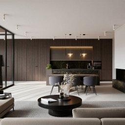 SEAPP Architektura wnętrz - Elegancki salon z aneksem kuchennym w ciemnym drewnie i zielonym marmurze. Szklana ściana z czarnymi ramami, beżowa sofa, okrągły stolik kawowy i minimalistyczne oświetlenie punktowe.