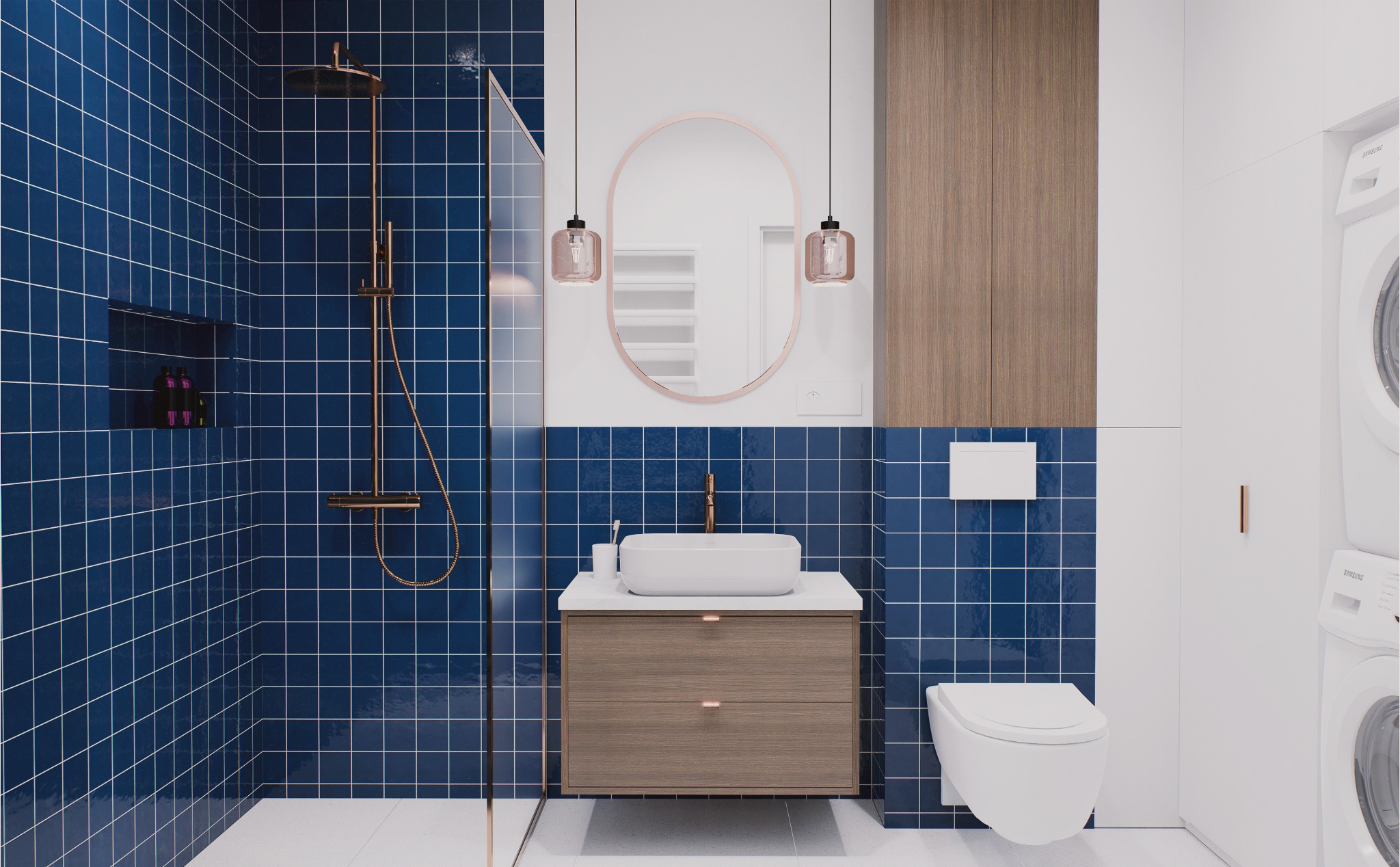 Nowoczesna łazienka z niebieskimi płytkami, kabiną prysznicową ze złotą armaturą, owalnym lustrem i drewnianą szafką pod umywalką. Widoczna pralka i toaleta.