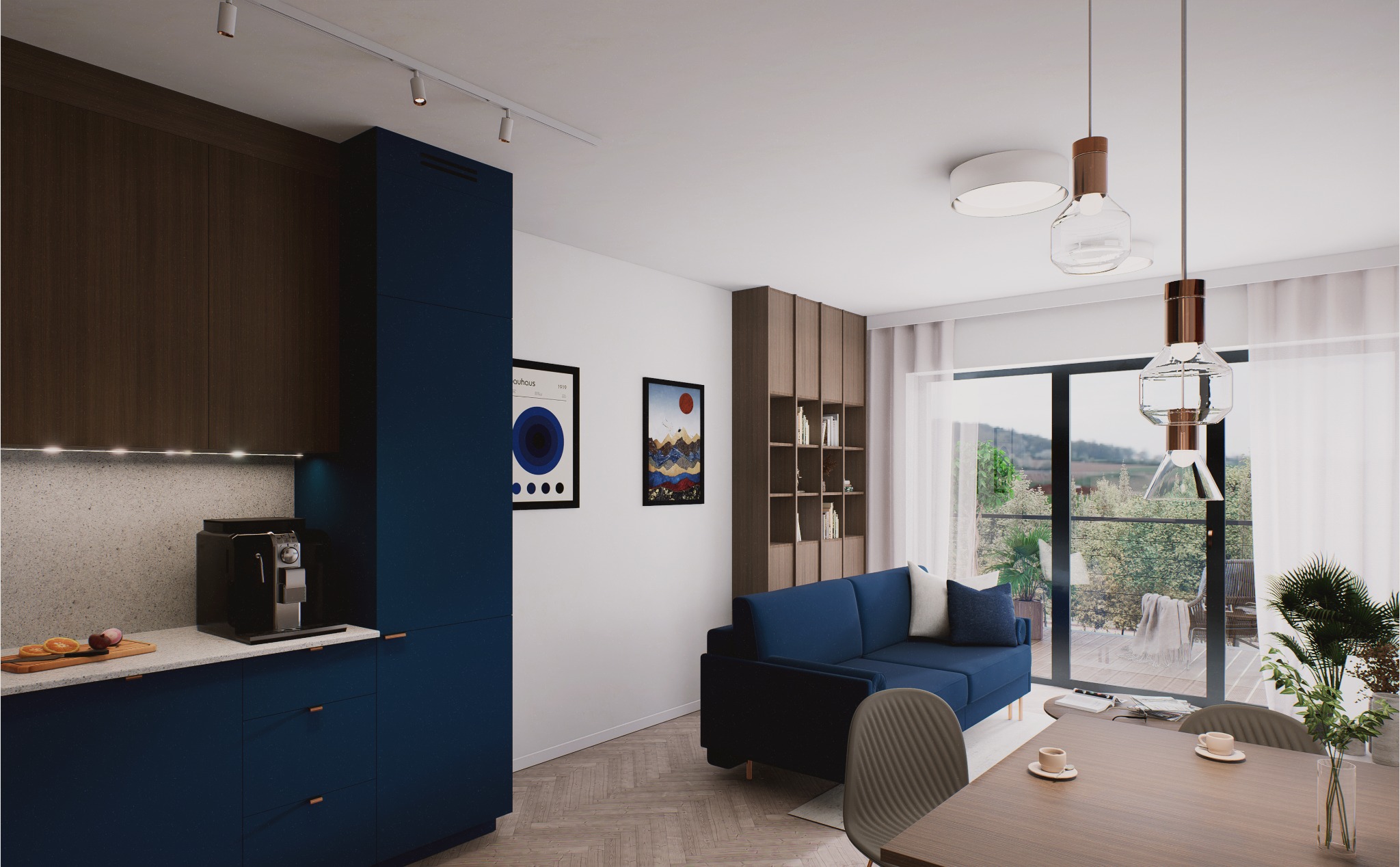 Wnętrze mieszkania z kuchnią w odcieniach brązu i granatu, salon z niebieską sofą i wyjściem na balkon. Na ścianie wiszą grafiki w czarnych ramkach.