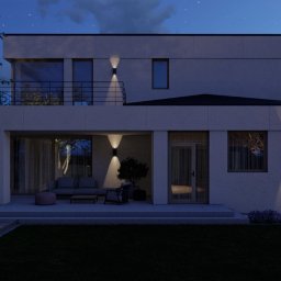 Wizualizacja ogrodu nocą - oświetlenie elewacji, tarasu i strefy wypoczynkowej podkreślające klimat ogrodu po zmroku.