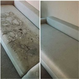 Vladyslav Pastushenko - Praniesof - Kanapa w odcieniach szarości: po lewej silnie zabrudzona plamami, po prawej czysta, po profesjonalnym praniu. Efekt 'przed i po' na tapicerce.