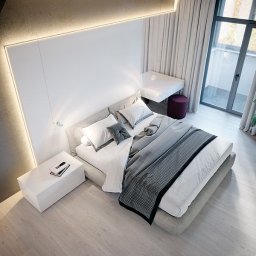 H.P. Agencja Nieruchomości - Nowoczesna sypialnia z balkonem w Wieliczce. Minimalistyczny design, białe ściany z oświetleniem LED, szare łóżko i drewniana podłoga. Widok z góry.